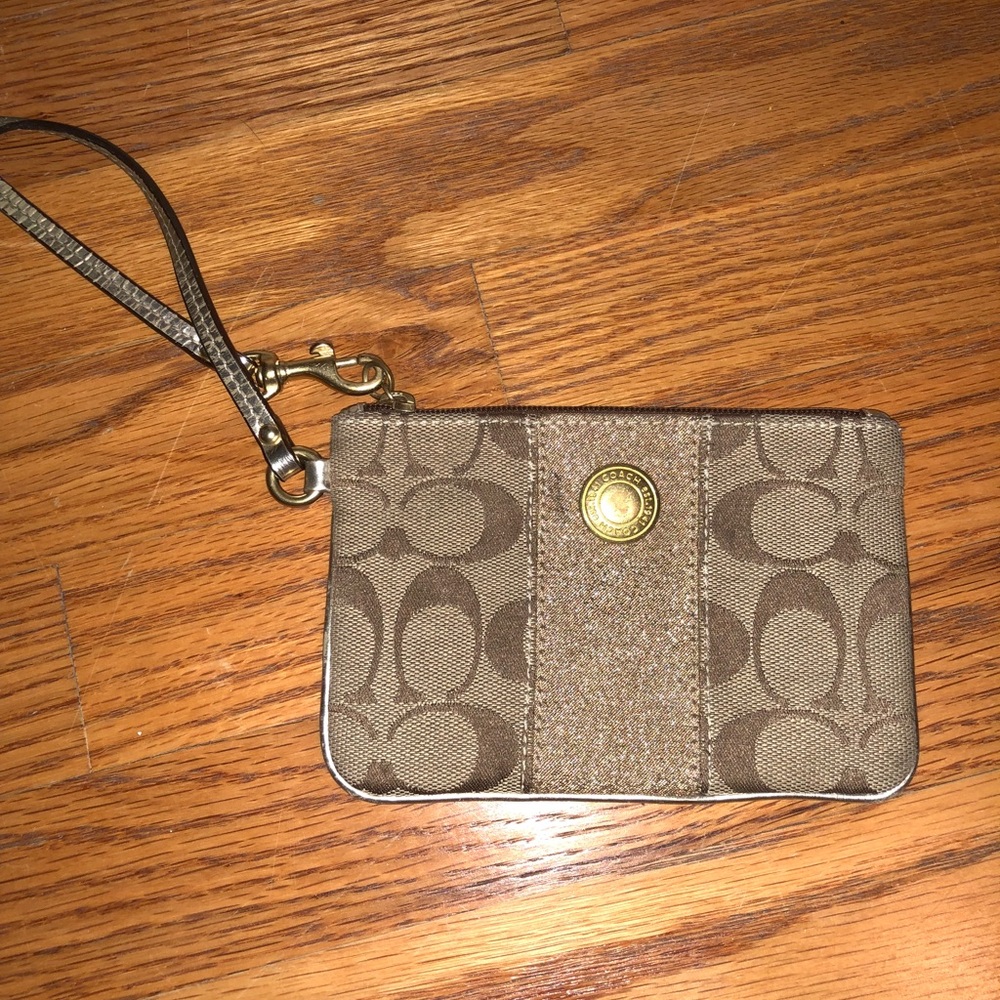 Small tan Coach wristlet